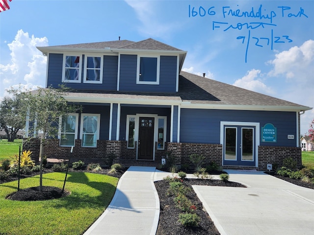 1606 Friendship Park Cir, Seabrook, TX 77586 - view of front of property featuring brick siding, a front lawn, roof with shingles, and a porch