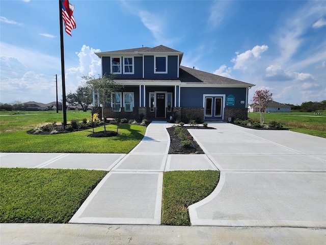 1606 Friendship Park Cir, Seabrook, TX 77586 - view of front facade with a front lawn, brick siding, and a shingled roof
