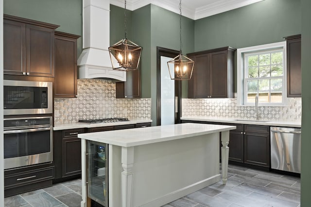 1148 Du Barry Ln, Houston, TX 77018 - kitchen with appliances with stainless steel finishes, a chandelier, custom range hood, wine cooler, and ornamental molding