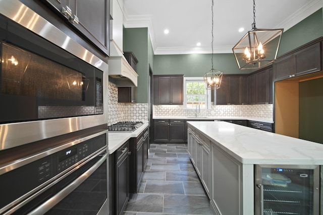 1148 Du Barry Ln, Houston, TX 77018 - kitchen featuring stainless steel appliances, wine cooler, a chandelier, crown molding, and light stone counters