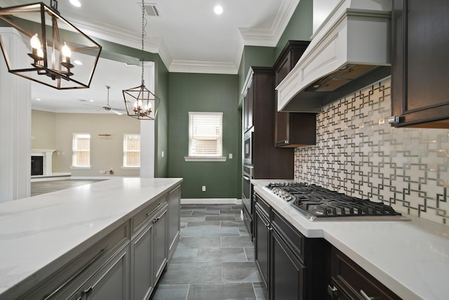 1148 Du Barry Ln, Houston, TX 77018 - kitchen featuring appliances with stainless steel finishes, a chandelier, custom range hood, backsplash, and ornamental molding