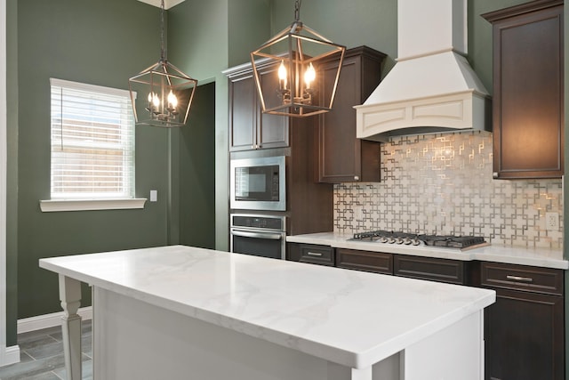 1148 Du Barry Ln, Houston, TX 77018 - kitchen with custom exhaust hood, appliances with stainless steel finishes, a chandelier, backsplash, and a center island