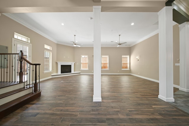 1148 Du Barry Ln, Houston, TX 77018 - unfurnished living room with ceiling fan, ornamental molding, ornate columns, dark wood-style flooring, and a fireplace with raised hearth