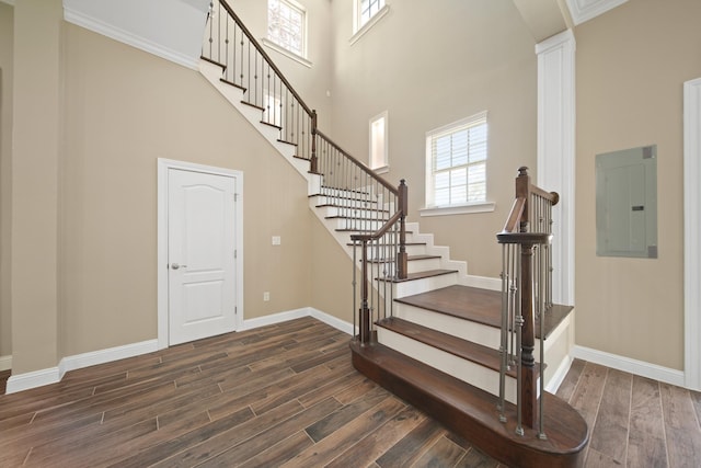 1148 Du Barry Ln, Houston, TX 77018 - staircase with electric panel, wood finished floors, and a towering ceiling