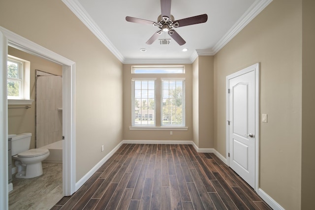1148 Du Barry Ln, Houston, TX 77018 - unfurnished bedroom with multiple windows, dark wood finished floors, ornamental molding, ensuite bath, and recessed lighting