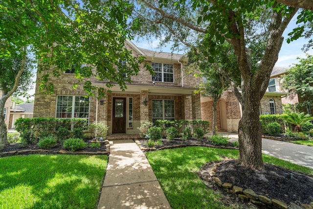 10522 Ginger Gln, Missouri City, TX 77459 - traditional-style house featuring brick siding and a front lawn