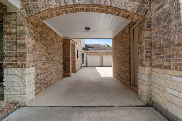 10522 Ginger Gln, Missouri City, TX 77459 - view of patio featuring a garage and driveway