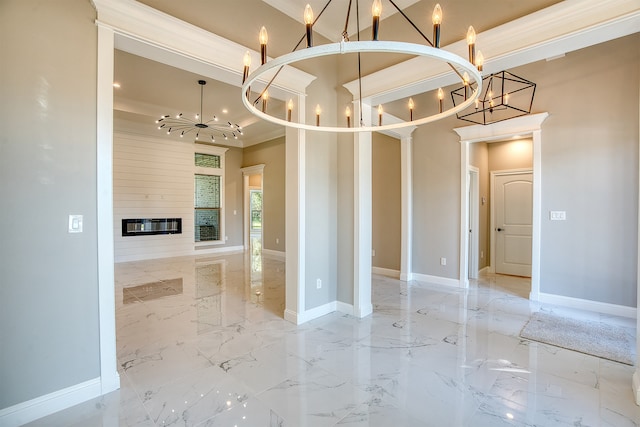 255 W Caldwood Dr, Beaumont, TX 77707 - spare room featuring a chandelier, ornamental molding, marble tiled flooring, a fireplace, and a towering ceiling