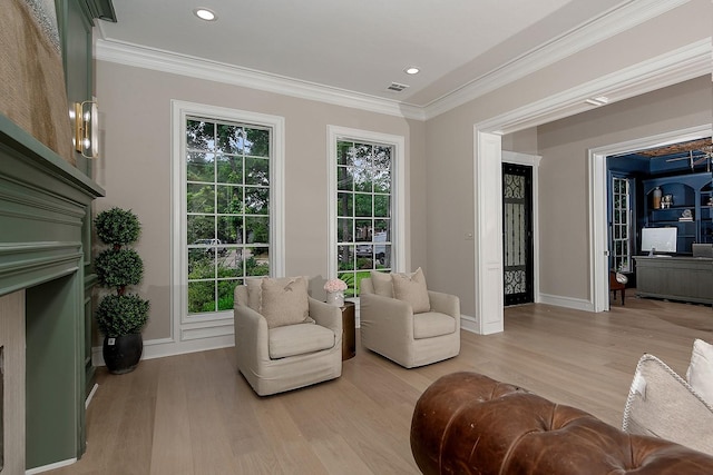 303 S Silvershire Cir, The Woodlands, TX 77381 - living area with light wood-style floors, ornamental molding, and recessed lighting