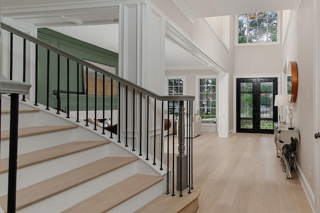 303 S Silvershire Cir, The Woodlands, TX 77381 - foyer with wood finished floors, stairs, crown molding, and a towering ceiling