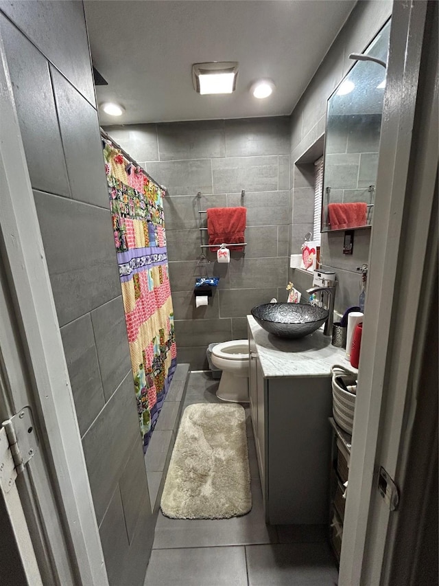 1114 Elton St, Houston, TX 77034 - full bathroom featuring tile patterned floors, vanity, tile walls, and a shower with shower curtain