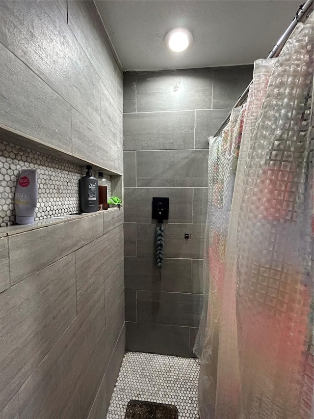 1114 Elton St, Houston, TX 77034 - full bathroom featuring a tile shower and tile patterned floors