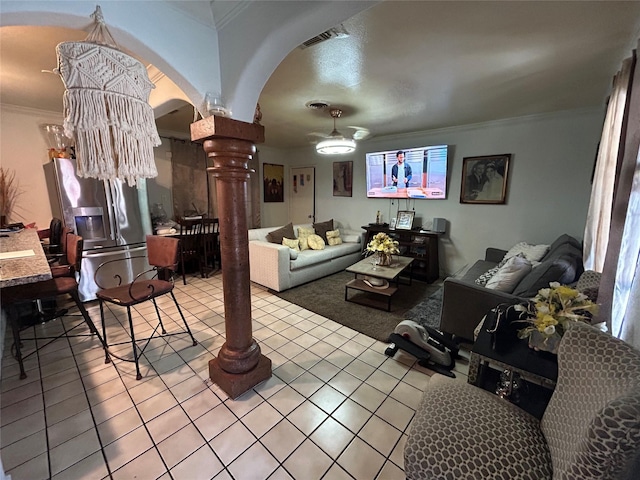 1114 Elton St, Houston, TX 77034 - living area featuring arched walkways, tile patterned floors, crown molding, decorative columns, and ceiling fan