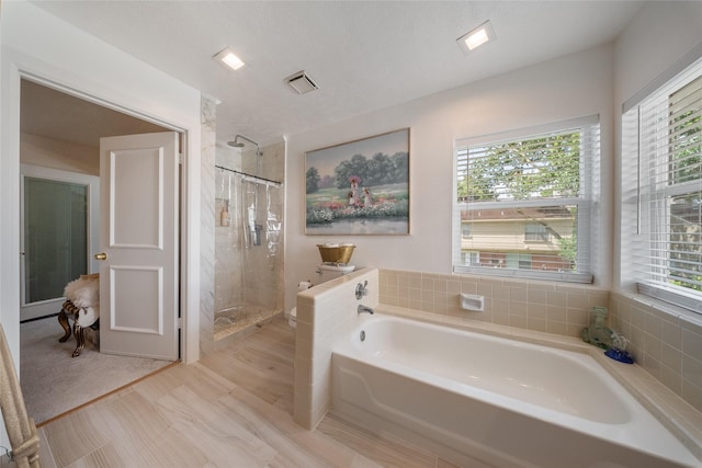 10135 Wayward Wind Ln, Houston, TX 77064 - bathroom with a bath and a stall shower