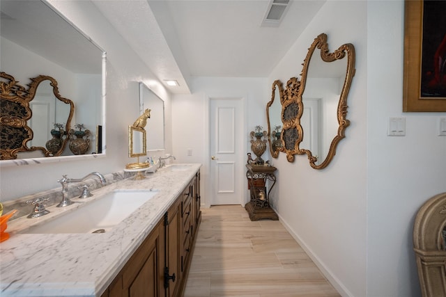 10135 Wayward Wind Ln, Houston, TX 77064 - full bath featuring double vanity and wood finished floors