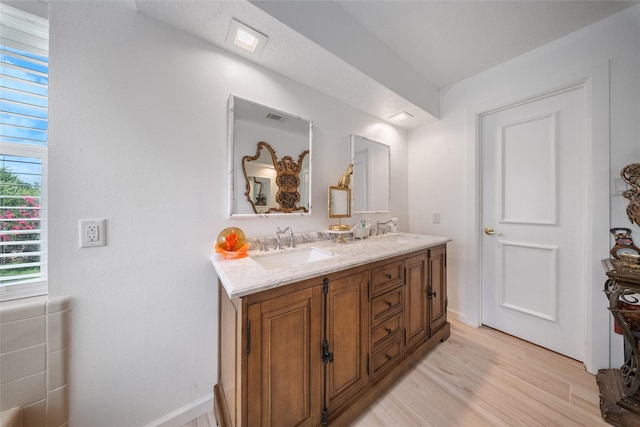 10135 Wayward Wind Ln, Houston, TX 77064 - full bath featuring double vanity and wood finished floors