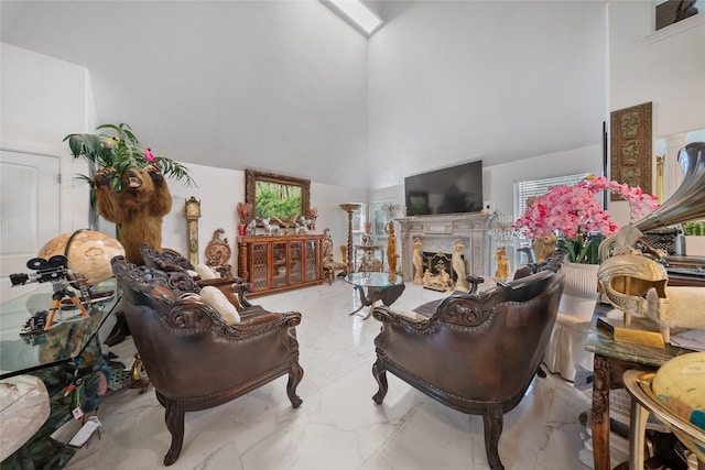 10135 Wayward Wind Ln, Houston, TX 77064 - living area featuring a towering ceiling, marble tiled flooring, plenty of natural light, and a fireplace