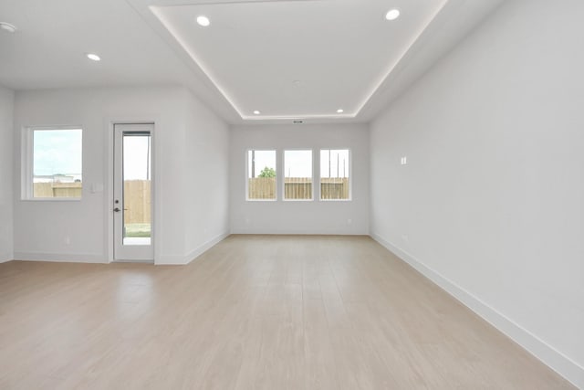 3003A Ventas Dr, Houston, TX 77047 - unfurnished room featuring recessed lighting, light wood-style floors, and a raised ceiling