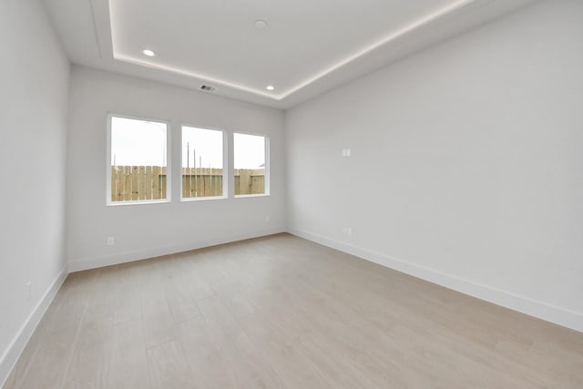 3003A Ventas Dr, Houston, TX 77047 - empty room with recessed lighting, light wood finished floors, and a tray ceiling