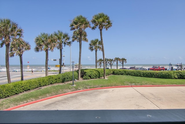 6102 Seawall Blvd Unit 105, Galveston, TX 77551 - view of property's community featuring a water view and a lawn