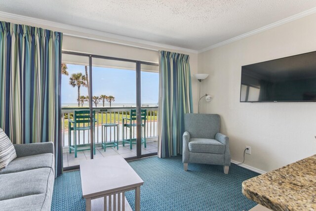 6102 Seawall Blvd Unit 105, Galveston, TX 77551 - carpeted living room featuring ornamental molding and a textured ceiling