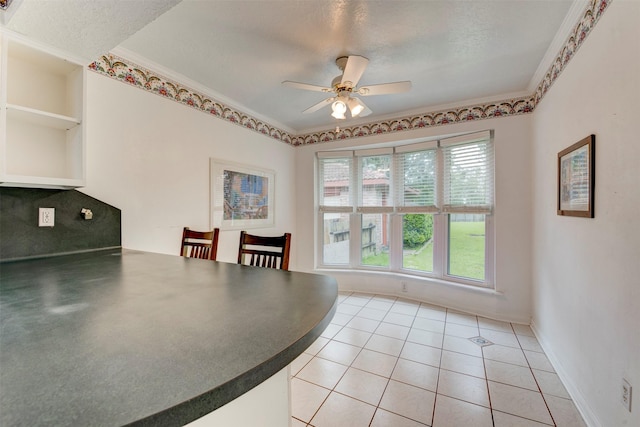 22619 Rockgate Dr, Spring, TX 77373 - dining area with a ceiling fan, light tile patterned flooring, and ornamental molding