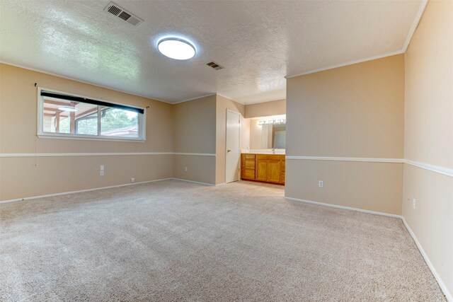22619 Rockgate Dr, Spring, TX 77373 - unfurnished room featuring light carpet and a textured ceiling