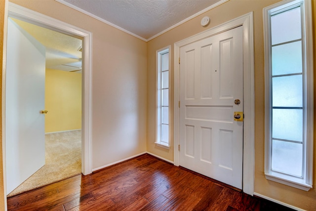 22619 Rockgate Dr, Spring, TX 77373 - entryway with dark wood-style floors, crown molding, and a textured ceiling