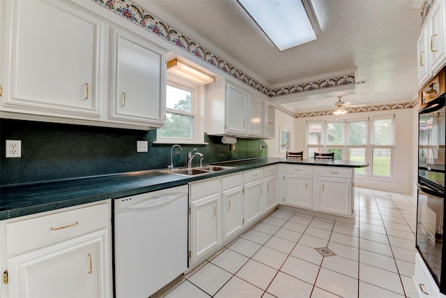 22619 Rockgate Dr, Spring, TX 77373 - kitchen featuring white dishwasher, a peninsula, dark countertops, backsplash, and crown molding