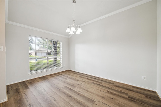 8211 Broken Timber Way, Houston, TX 77095 - spare room featuring crown molding, a chandelier, wood finished floors, and lofted ceiling