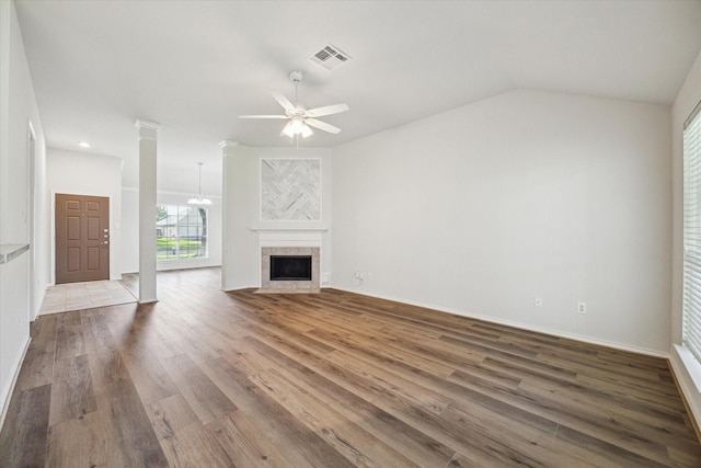8211 Broken Timber Way, Houston, TX 77095 - unfurnished living room with ceiling fan, wood finished floors, a fireplace, and ornate columns