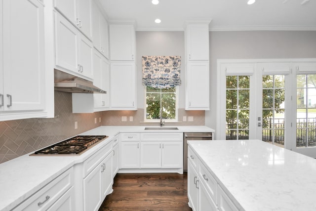 206 Green Blvd, Shenandoah, TX 77384 - kitchen featuring appliances with stainless steel finishes, under cabinet range hood, ornamental molding, dark wood-type flooring, and recessed lighting