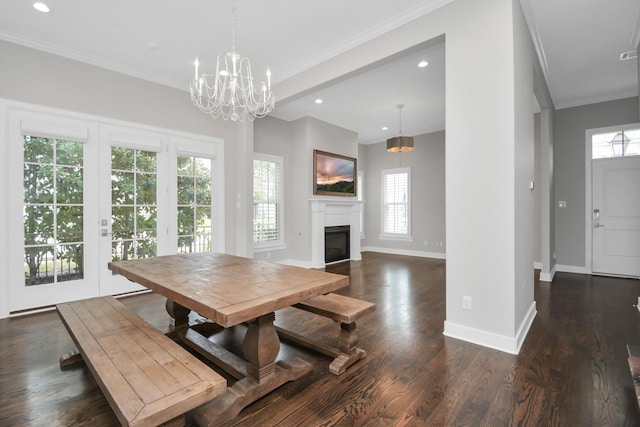 206 Green Blvd, Shenandoah, TX 77384 - dining area with plenty of natural light, dark wood-type flooring, crown molding, recessed lighting, and a fireplace