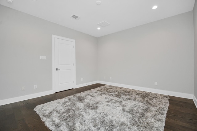 206 Green Blvd, Shenandoah, TX 77384 - spare room featuring dark wood-type flooring and recessed lighting