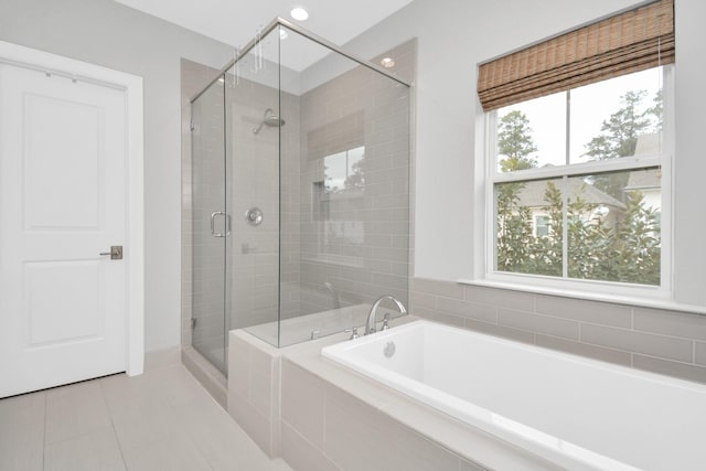 206 Green Blvd, Shenandoah, TX 77384 - full bath featuring a garden tub, a shower stall, and tile patterned flooring