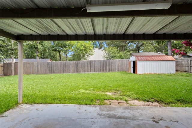 217 Wellwood Ln, Conroe, TX 77304 - fenced backyard with a shed and a patio