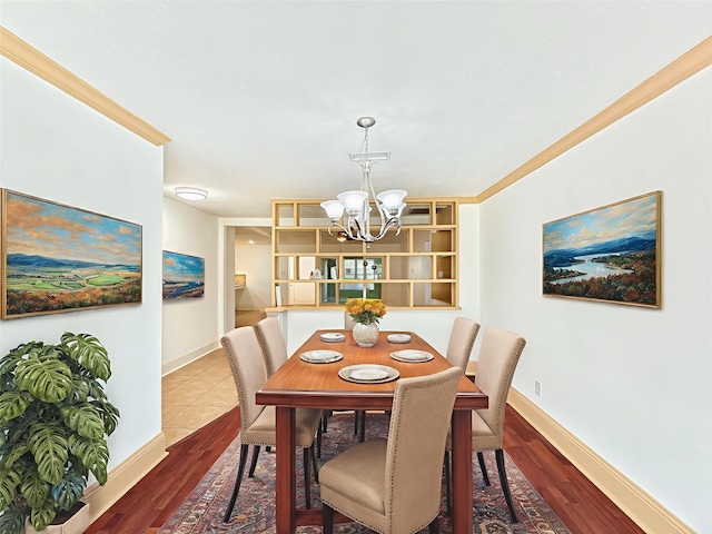 7123 Galleon Dr, Houston, TX 77036 - dining area with a chandelier, wood finished floors, and ornamental molding