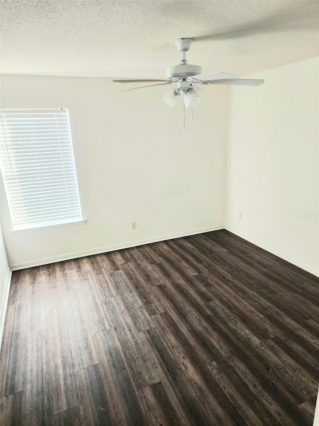 6500 Sands Point Dr Unit 104, Houston, TX 77074 - spare room featuring dark wood finished floors, a ceiling fan, and a textured ceiling