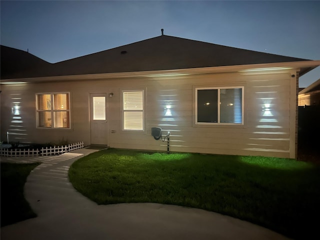 21319 Indigo Ruth Dr, Spring, TX 77379 - back of house at night with a yard