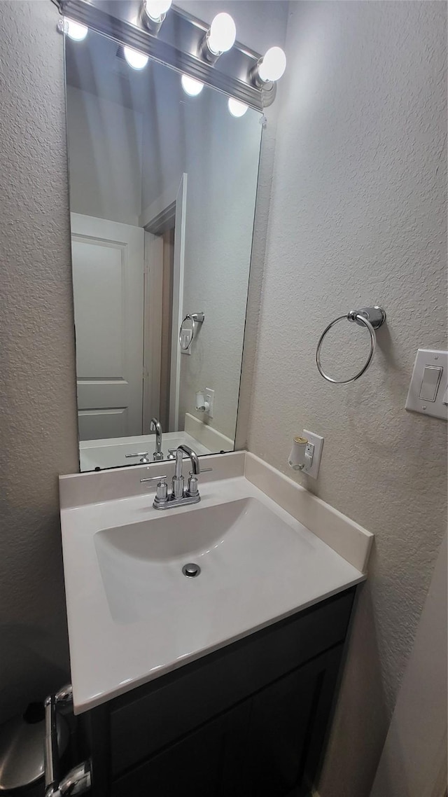 21319 Indigo Ruth Dr, Spring, TX 77379 - bathroom with a textured wall and vanity