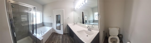 21319 Indigo Ruth Dr, Spring, TX 77379 - full bathroom with a garden tub, vanity, wood finished floors, and a stall shower