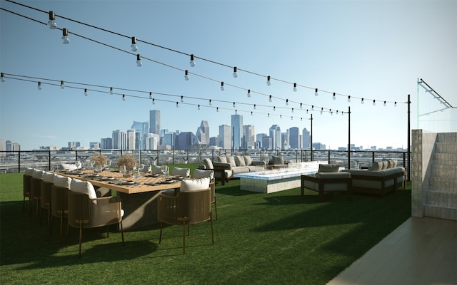 2520 Houston Ave Unit 701, Houston, TX 77009 - view of property's community featuring a view of skyline and an outdoor living space with a fire pit