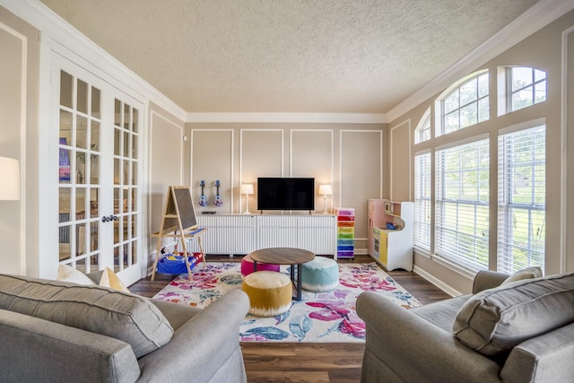 20919 Autumn Redwood Way, Cypress, TX 77433 - living room with french doors, a decorative wall, crown molding, wood finished floors, and a textured ceiling