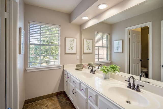 20919 Autumn Redwood Way, Cypress, TX 77433 - full bath with double vanity, tile patterned floors, plenty of natural light, and recessed lighting