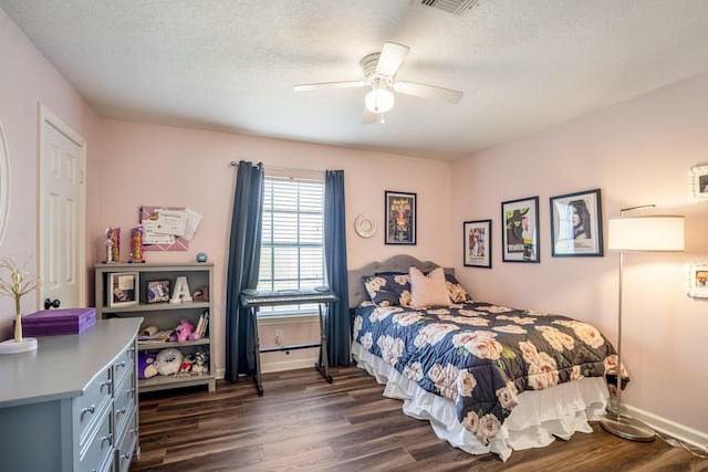 20919 Autumn Redwood Way, Cypress, TX 77433 - bedroom with dark wood finished floors, a textured ceiling, and a ceiling fan
