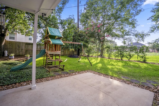 20919 Autumn Redwood Way, Cypress, TX 77433 - fenced backyard featuring a playground and a patio