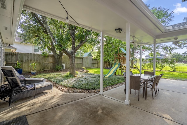20919 Autumn Redwood Way, Cypress, TX 77433 - fenced backyard featuring a patio, a playground, and outdoor dining space