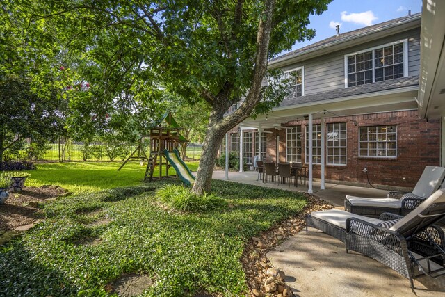 20919 Autumn Redwood Way, Cypress, TX 77433 - view of yard with a patio and a playground
