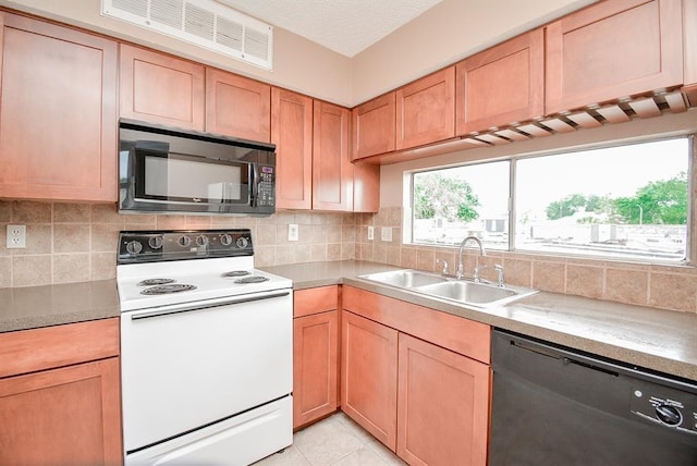 10855 Meadowglen Ln Unit 721, Houston, TX 77042 - kitchen featuring white electric range, black microwave, dishwasher, and backsplash