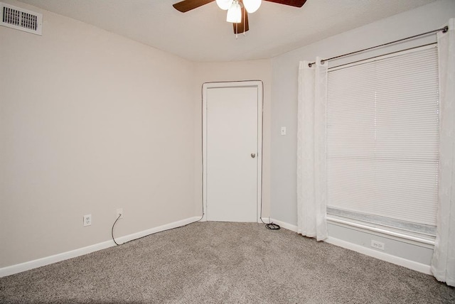 10855 Meadowglen Ln Unit 721, Houston, TX 77042 - unfurnished bedroom featuring carpet and a ceiling fan